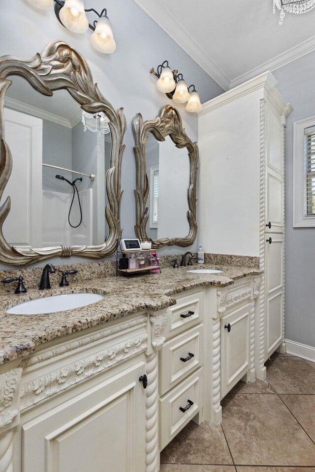 bathroom with tile patterned floors, vanity, a shower, and ornamental molding