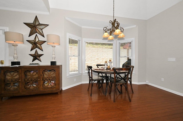 dining space featuring a chandelier, dark hardwood / wood-style flooring, and crown molding