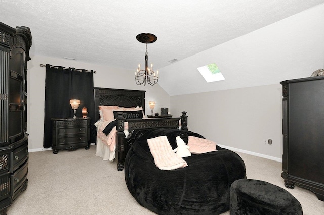 carpeted bedroom featuring lofted ceiling with skylight, a textured ceiling, and a notable chandelier