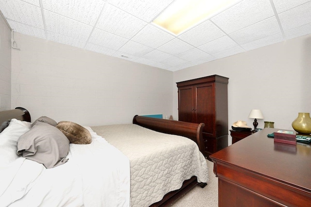 bedroom with a paneled ceiling