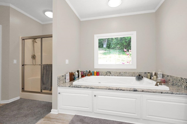 bathroom featuring ornamental molding, independent shower and bath, and hardwood / wood-style floors