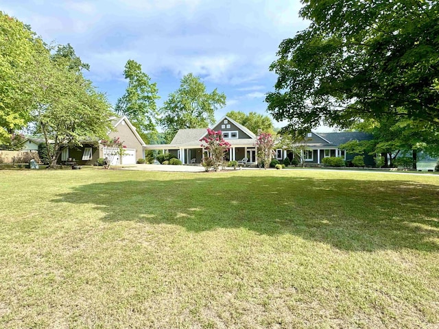 craftsman-style house with a garage and a front lawn