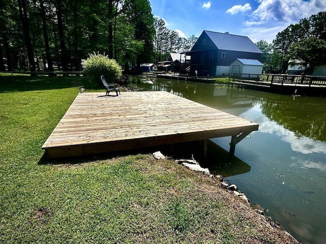  - dock with a water view and a yard
