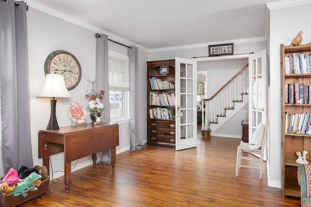 interior space featuring french doors, ornamental molding, and hardwood / wood-style flooring