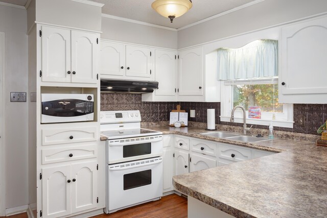 kitchen with decorative backsplash, white cabinetry, sink, and white appliances