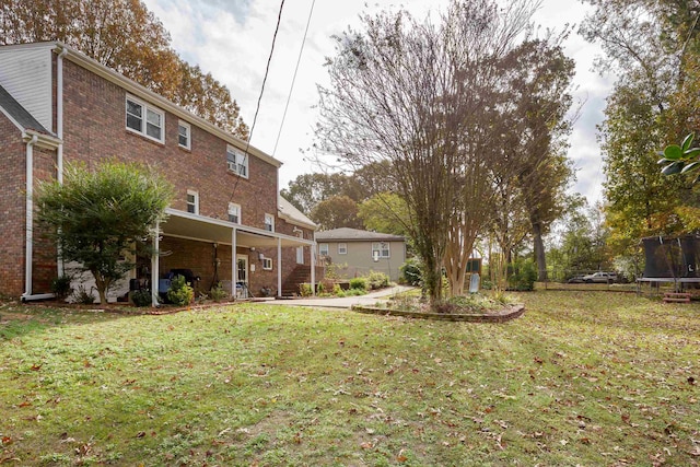 view of yard with a trampoline