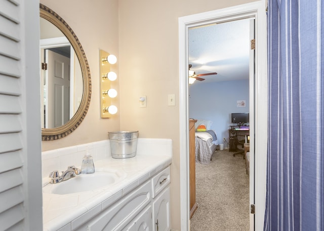 bathroom with ceiling fan and vanity