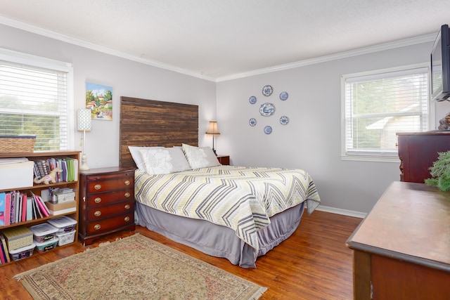 bedroom featuring dark hardwood / wood-style flooring and crown molding