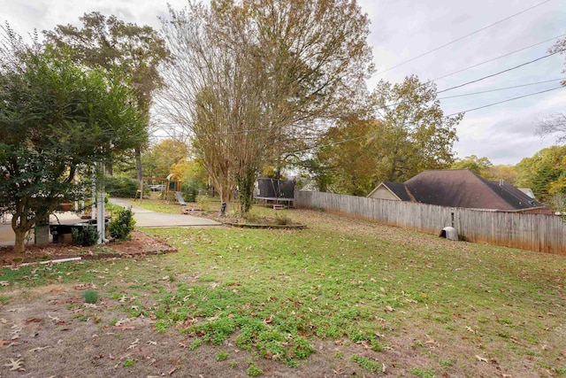 view of yard featuring a trampoline