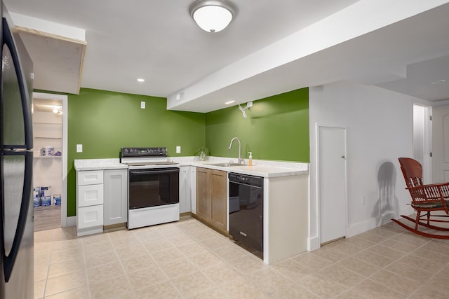 kitchen with white cabinets, white electric range, sink, stainless steel fridge, and black dishwasher