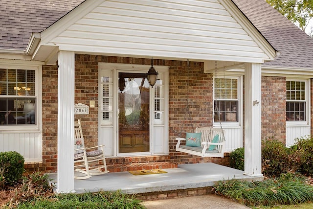 doorway to property featuring covered porch