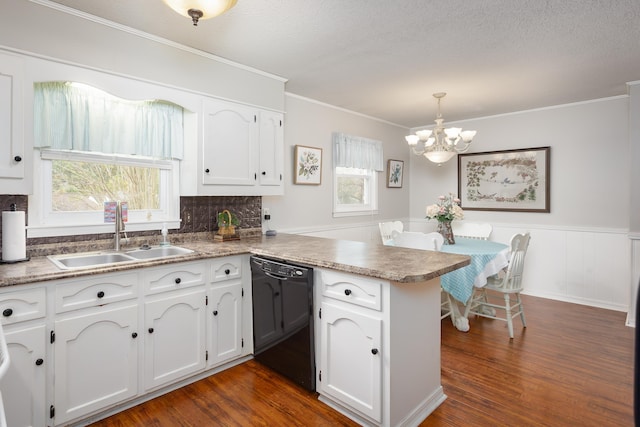 kitchen featuring dishwasher, white cabinets, sink, hanging light fixtures, and kitchen peninsula