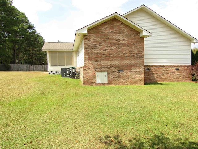 view of home's exterior with a lawn