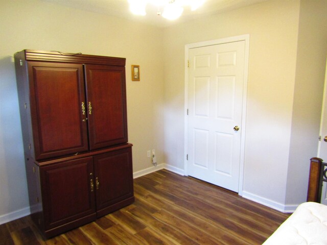 bedroom featuring dark hardwood / wood-style flooring