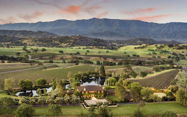 property view of mountains featuring a rural view and a water view