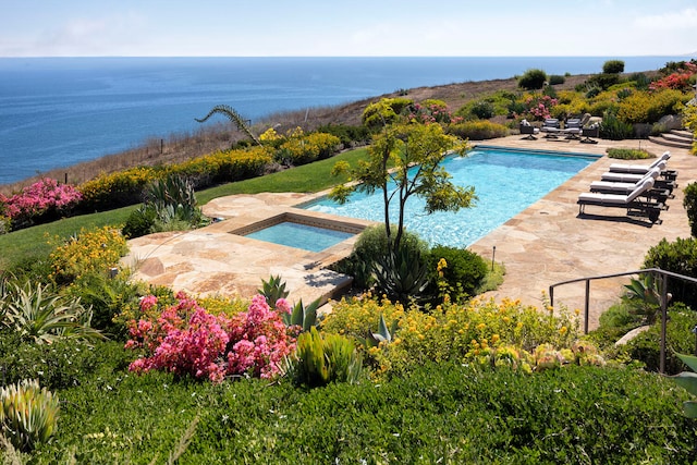 view of pool featuring an in ground hot tub and a patio area