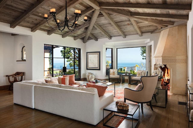 living room with an inviting chandelier, dark hardwood / wood-style floors, wood ceiling, and a wealth of natural light