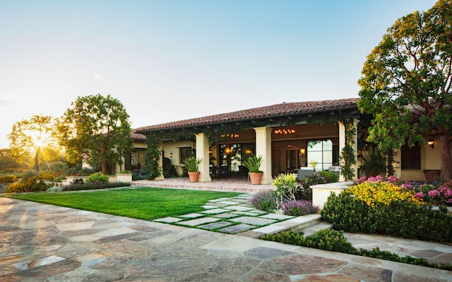 rear view of house with a lawn