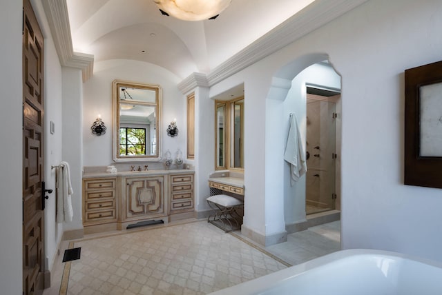 bathroom with shower with separate bathtub, vanity with extensive cabinet space, tile floors, and lofted ceiling