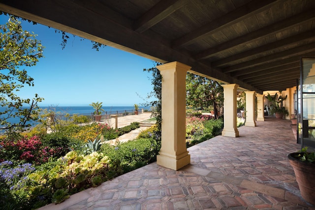 view of terrace featuring a water view