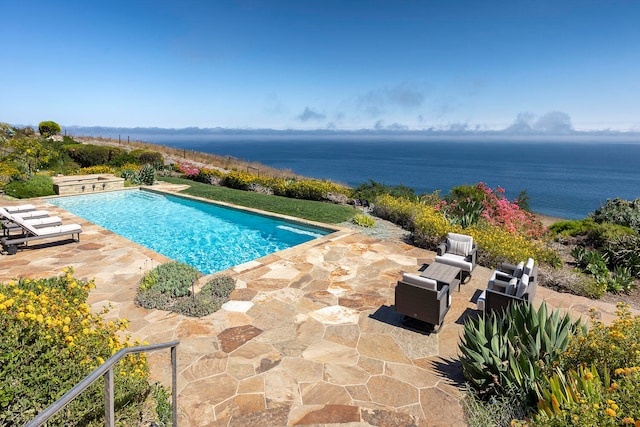 view of swimming pool with a water view, outdoor lounge area, and a patio