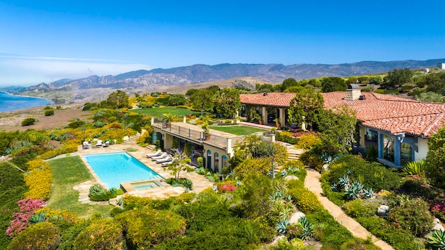 birds eye view of property with a mountain view