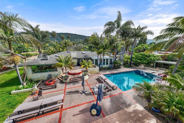 view of swimming pool featuring a patio