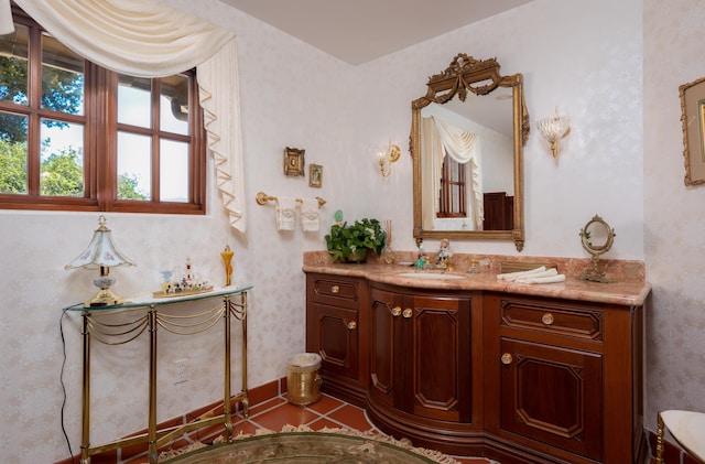 bathroom with tile floors and vanity