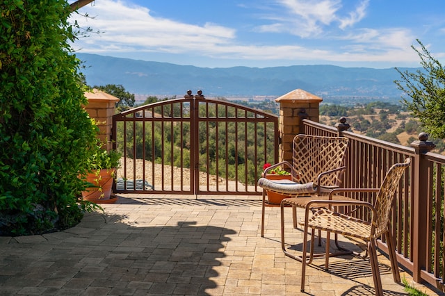 view of gate featuring a mountain view