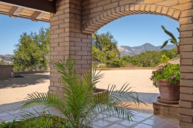 view of patio / terrace with a mountain view