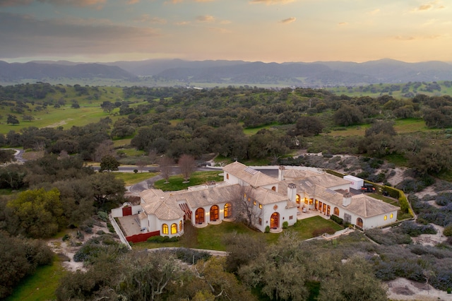 aerial view at dusk with a mountain view