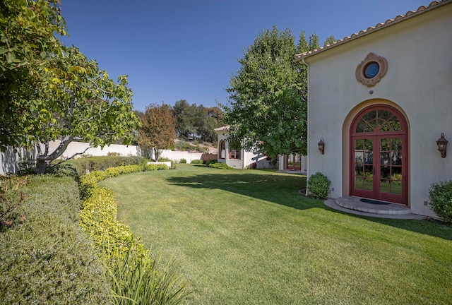 view of yard with french doors