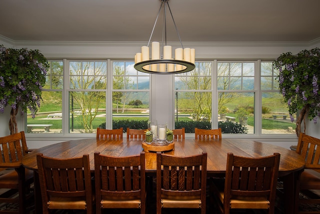 dining space featuring an inviting chandelier and ornamental molding