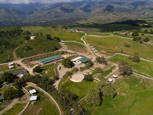 birds eye view of property with a mountain view and a rural view