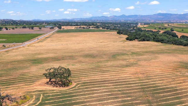 drone / aerial view with a mountain view and a rural view