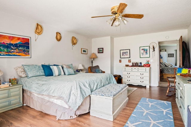 bedroom featuring wood finished floors and ceiling fan