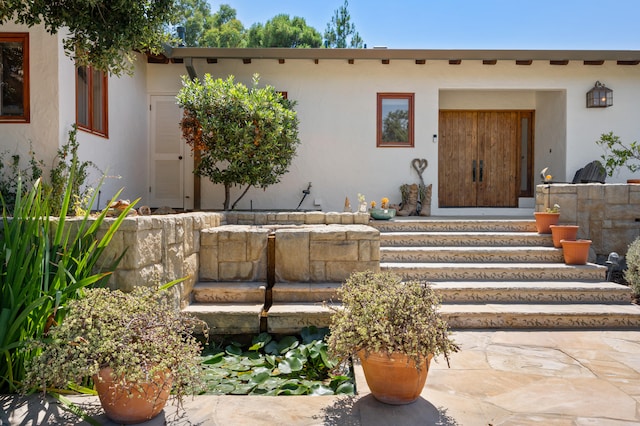 adobe home featuring a patio