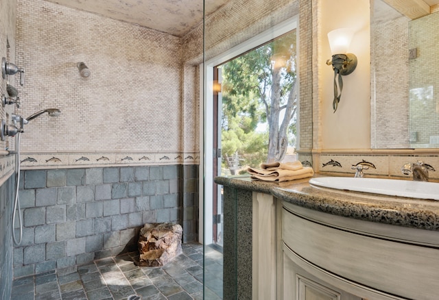 bathroom with tile walls and vanity