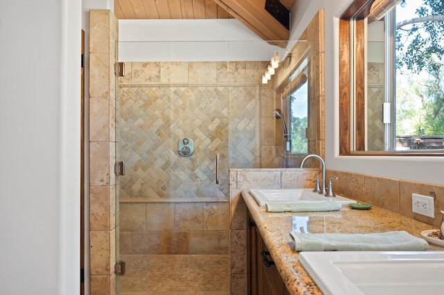 bathroom with shower with separate bathtub, large vanity, and a wealth of natural light