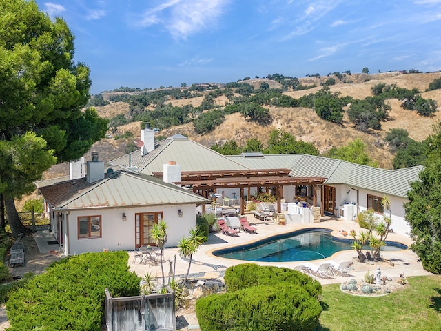 back of property featuring a patio