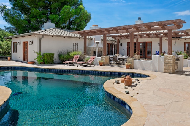 view of swimming pool featuring a pergola and a patio area