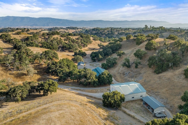 birds eye view of property featuring a mountain view