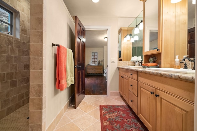 bathroom featuring double sink vanity and tile flooring