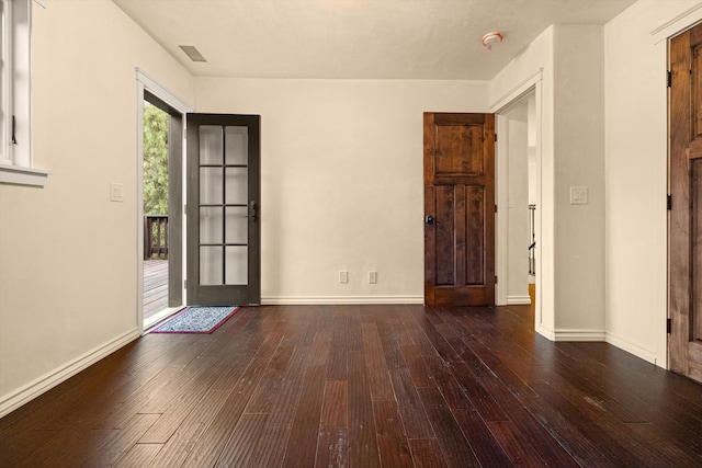 entrance foyer featuring dark hardwood / wood-style floors