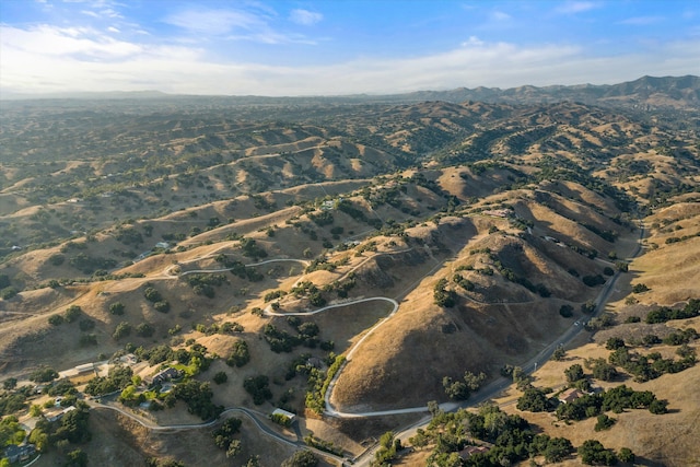 birds eye view of property featuring a mountain view