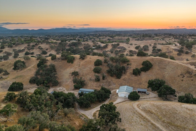 aerial view at dusk with a mountain view