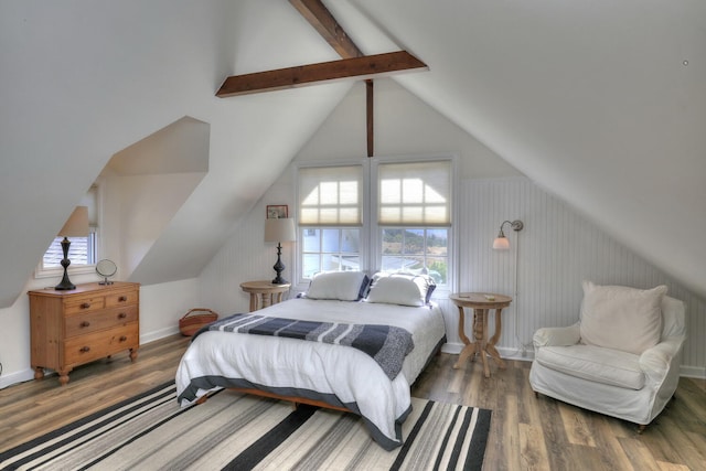 bedroom with vaulted ceiling with beams and dark wood-type flooring