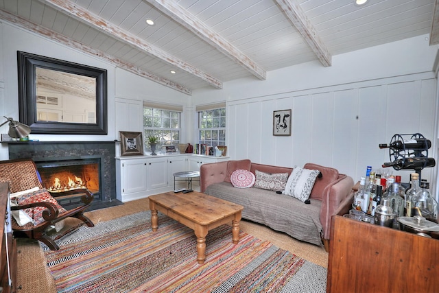 carpeted living room featuring vaulted ceiling with beams