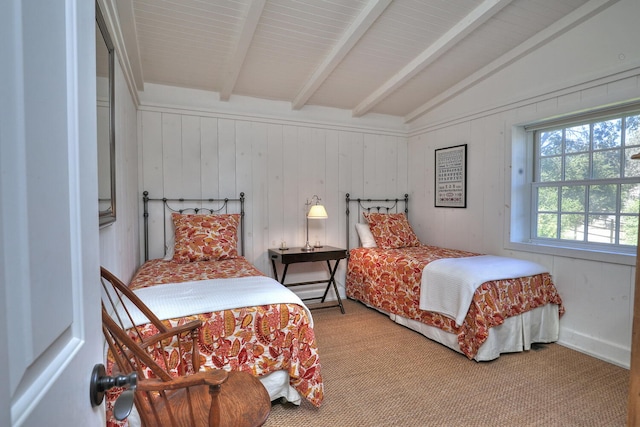 bedroom featuring lofted ceiling with beams