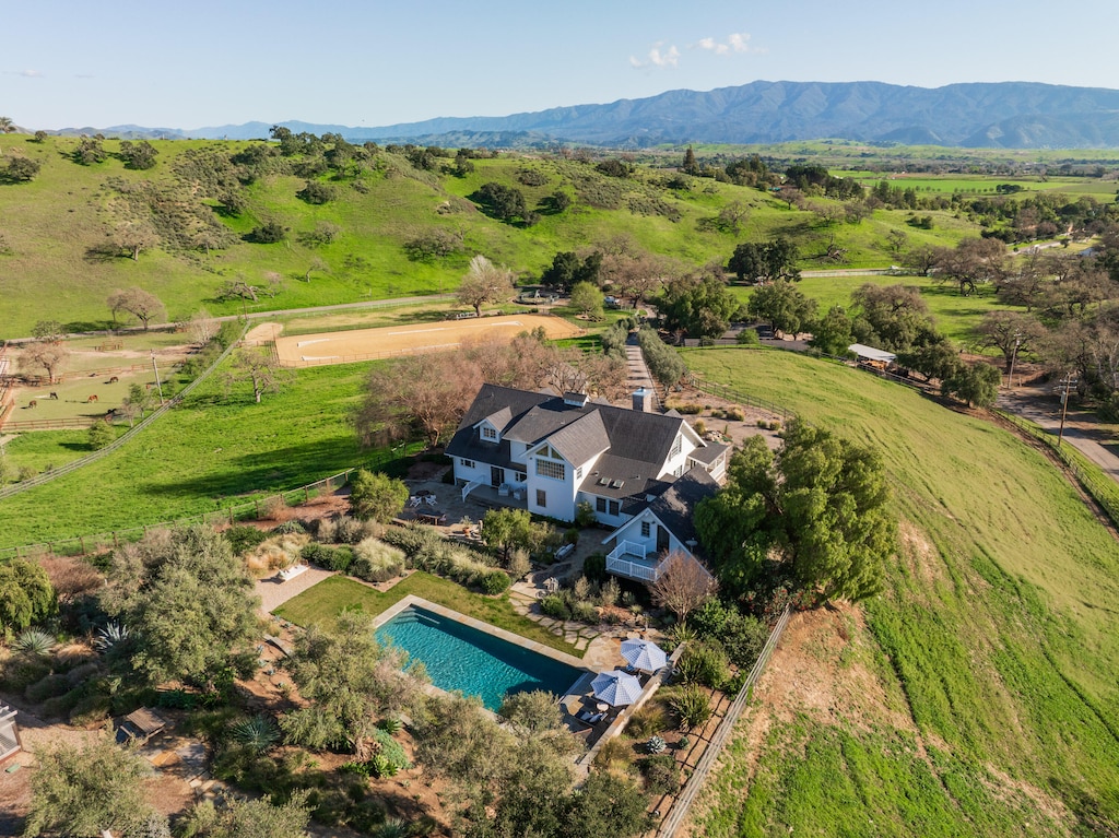 aerial view featuring a rural view and a mountain view